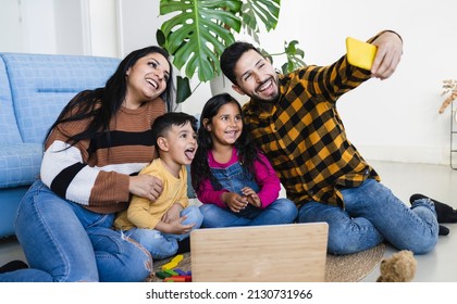 Hispanic Family At Home Taking A Photo With A Cell Phone