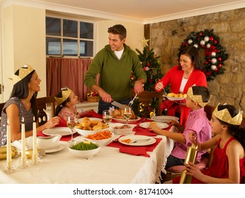 Hispanic Family Serving Christmas Dinner