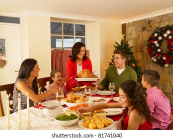 Hispanic Family Serving Christmas Dinner