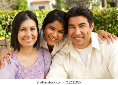 Hispanic Family With A Teen Daughter.