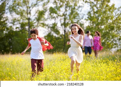 Hispanic Family Walking In Countryside