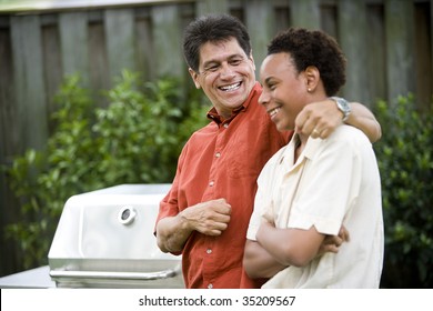 Hispanic Father With African American Teenage Son