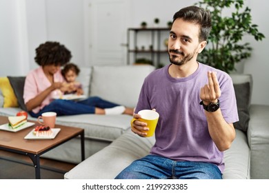 Hispanic Father Of Interracial Family Drinking A Cup Coffee Doing Italian Gesture With Hand And Fingers Confident Expression 