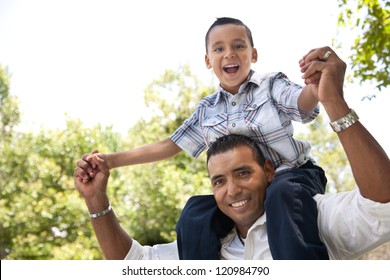 Hispanic Father and Son Having Fun Together in the Park.