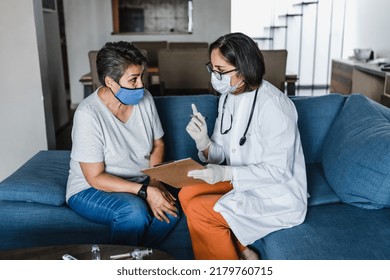 Hispanic Female Doctor Giving Covid Vaccine To Senior Woman In Her Home In Mexico Latin America