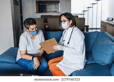 Hispanic Female Doctor Giving Covid Vaccine To Senior Woman In Her Home In Mexico Latin America