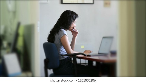 Hispanic Girl At The Office In Front Of Laptop Computer Scree