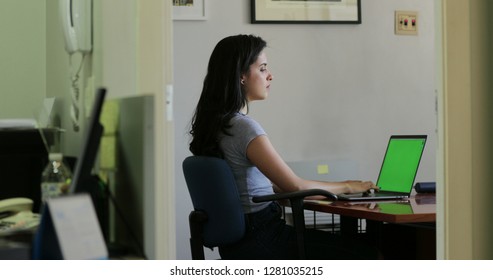 Hispanic Girl At The Office In Front Of Laptop Computer Scree