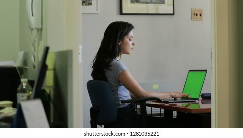 Hispanic Girl At The Office In Front Of Laptop Computer Scree