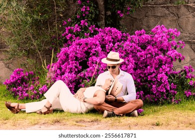 Hispanic Latino couple in a park with bougainvilleas - Powered by Shutterstock