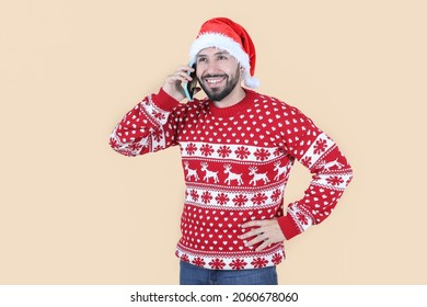 Hispanic Latino Man With Christmas Hat Using Mobile Phone