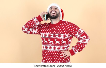 Hispanic Latino Man With Christmas Hat Using Mobile Phone