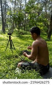 Hispanic Latino Man Giving Class, While Being Recorded By A Camera, Holding Ipad Or Tablet In His Hand, Mexico, Latin America