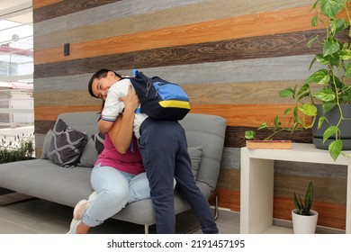 Hispanic Latino Mom And Son Prepare For Back To School In Uniform And Backpack Say Goodbye In The Morning