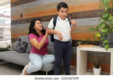 Hispanic Latino Mom And Son Prepare For Back To School In Uniform And Backpack Say Goodbye In The Morning