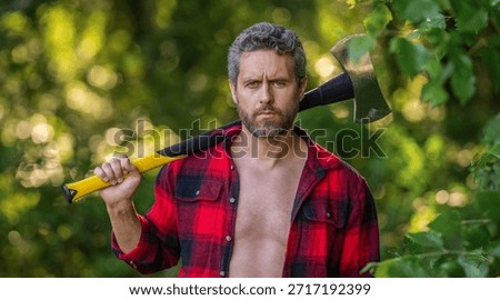 Hispanic lumberjack man with axe. Lumberjack axe. Man with logging axe. Hardworking brutal man. Lumberjack hardworking outdoor. Brutal lumberjack. Brutality and masculinity. Timber cutter