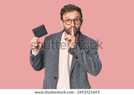 Hispanic male with briefcase in studio keeping a secret or asking for silence.