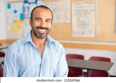 Hispanic Male Teacher in his classroom