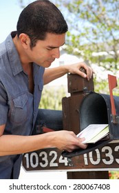 Hispanic Man Checking Mailbox