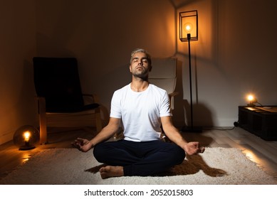 Hispanic Man Meditating In A Room. Healthy Morning Routine Concept.