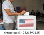 hispanic man placing his vote ballot in the polling box in the us elections of usa, cituzen voting in america 2024