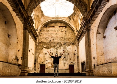 Hispanic Man Praying Inside Of A Church For The End Of The Coronavirus Pandemic