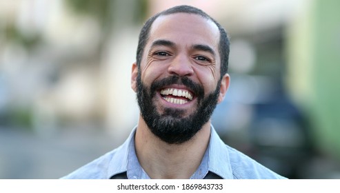 Hispanic Man Smiling At Camera Standing Outside In Street. South American Person Portrait Smile