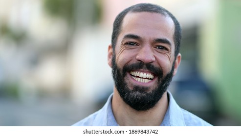 Hispanic Man Smiling At Camera Standing Outside In Street. South American Person Portrait Smile