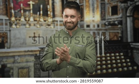 Hispanic man softly clapping hands beside marble altar inside ornate baroque church building; reverence faith gratitude.