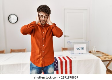 Hispanic Man Standing By Election Room With Hand On Head For Pain In Head Because Stress. Suffering Migraine. 