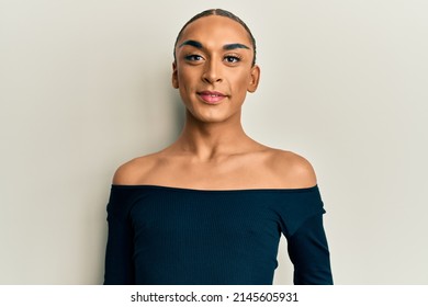 Hispanic Man Wearing Make Up And Long Hair Wearing Woman Fashion Clothes With A Happy And Cool Smile On Face. Lucky Person. 