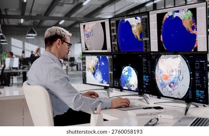 Hispanic Meteorologist Analyzing Hurricane Data On Multiple Screens To Predict Climate Impact