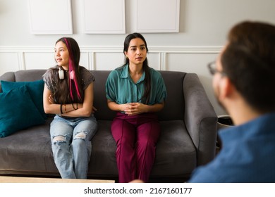 Hispanic Mom And Her Angry Teen Daughter With Bad Behavior Asking For Advice To A Therapist