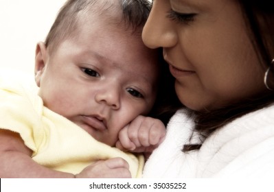 Hispanic Mother Holding Child