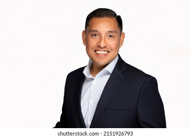 Hispanic Or Pacific Islander Man In Business Suit Smiling At The Camera On A White Background