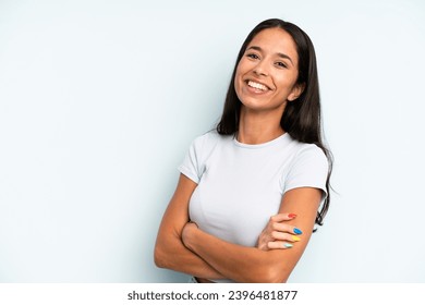 hispanic pretty woman laughing happily with arms crossed, with a relaxed, positive and satisfied pose - Powered by Shutterstock