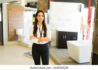 Hispanic salesperson smiling and ready to give customer service at the furniture store