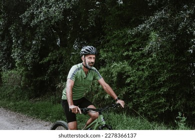 hispanic Senior man on his mountain bike cycling outdoors in Mexico Latin America  - Powered by Shutterstock