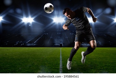 Hispanic Soccer Player Heading The Ball