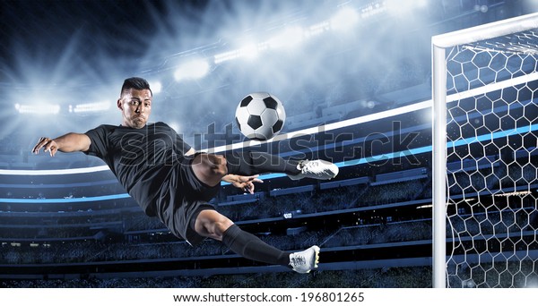 Hispanic Soccer Player\
kicking the ball