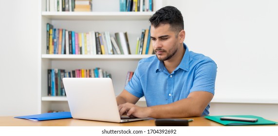 Hispanic Software Developer Stay At Home And Work With Concentration At Computer At Home