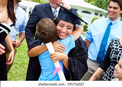 Hispanic Student And Family Celebrating Graduation