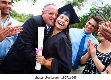 Hispanic Student And Family Celebrating Graduation