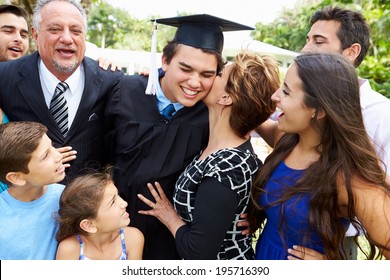 Hispanic Student And Family Celebrating Graduation