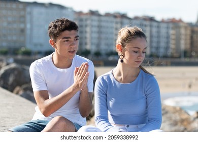 Hispanic Teenager Boy Asking For Forgiveness To His Sad Girlfriend.