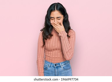 Hispanic Teenager Girl With Dental Braces Wearing Casual Clothes Feeling Unwell And Coughing As Symptom For Cold Or Bronchitis. Health Care Concept. 