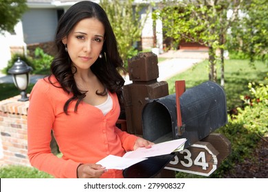 Hispanic Woman Checking Mailbox