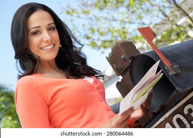 Hispanic Woman Checking Mailbox