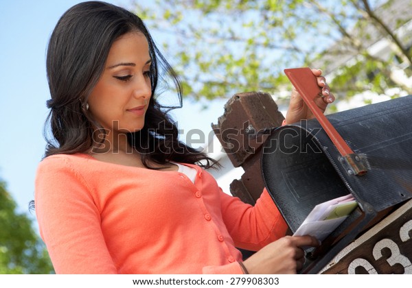 Hispanic Woman Checking\
Mailbox