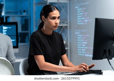 Hispanic woman engineer software coding keyboard programming computer screen tech digital information website analytics automation cloud virtual solutions innovation electronics